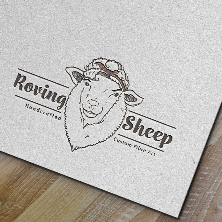 Roving Sheep logo imprinted into a piece of paper